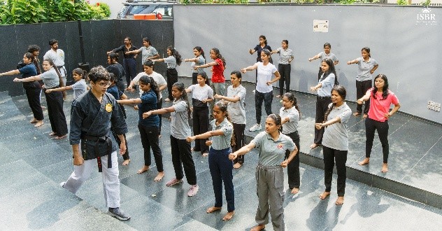 ISBR Business School students participating in a self-defense masterclass led by OSK Federation of India to promote personal safety, confidence, and leadership among young women.