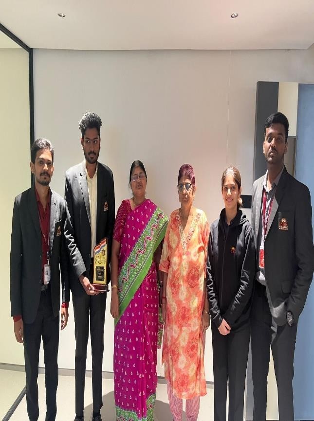 Winners of the national-level business quiz holding trophies at ABBS