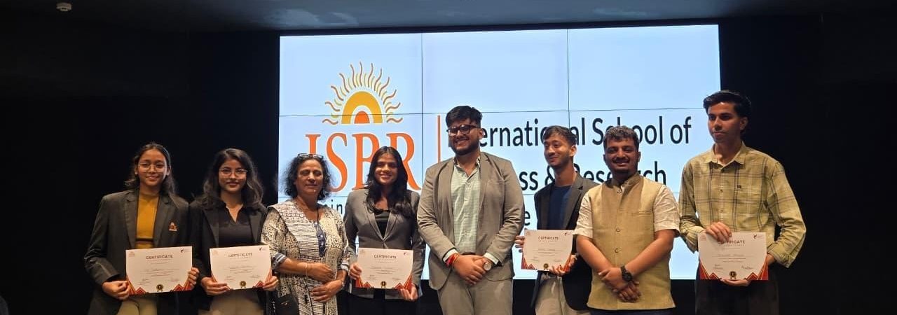“ISBR Business School students participating in a business negotiation competition judged by alumnus Rishov Mukherjee”