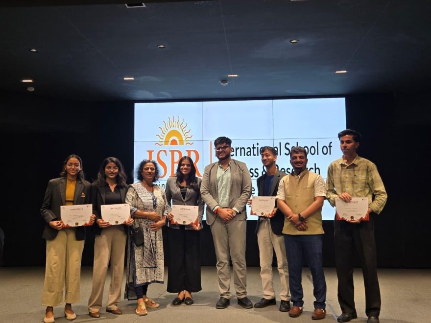 “ISBR Business School students participating in a business negotiation competition judged by alumnus Rishov Mukherjee”